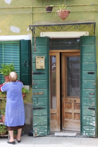 A little local lady at her door Burano